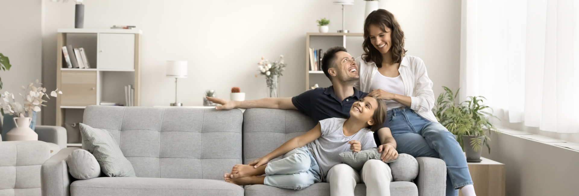 Small Family On An Airbnb Couch 1920X650